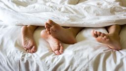Foot man and girl be tired on the bed, couple bed story; Shutterstock ID 642965416; Job: -
