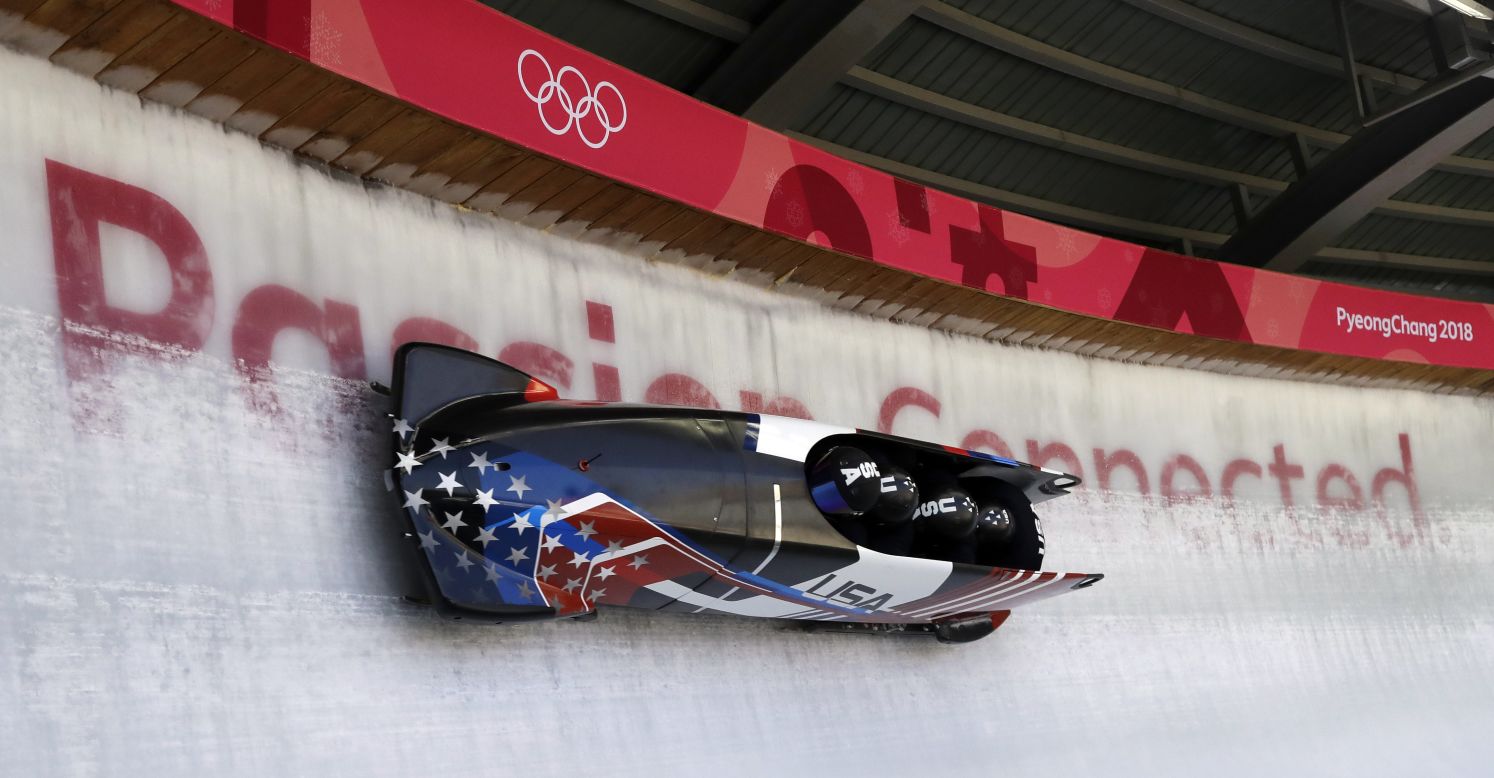 Nick Cunningham drives a US bobsled during a four-man training run.