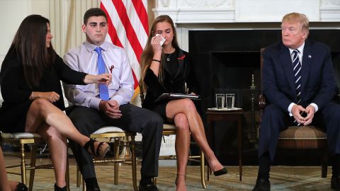 WASHINGTON, DC - FEBRUARY 21: (AFP OUT) U.S. President Donald Trump (R) hosts a listening session with Marjory Stoneman Douglas High School shooting survivors Julie Cordover (2nd R) and Jonathan Blank and his mother Melissa Blank and others in the State Dining Room at the White House February 21, 2018 in Washington, DC. Trump is hosted the session in the wake of last week's mass shooting at the high school in Parkland, Florida, that left 17 students and teachers dead. (Photo by Chip Somodevilla/Getty Images)