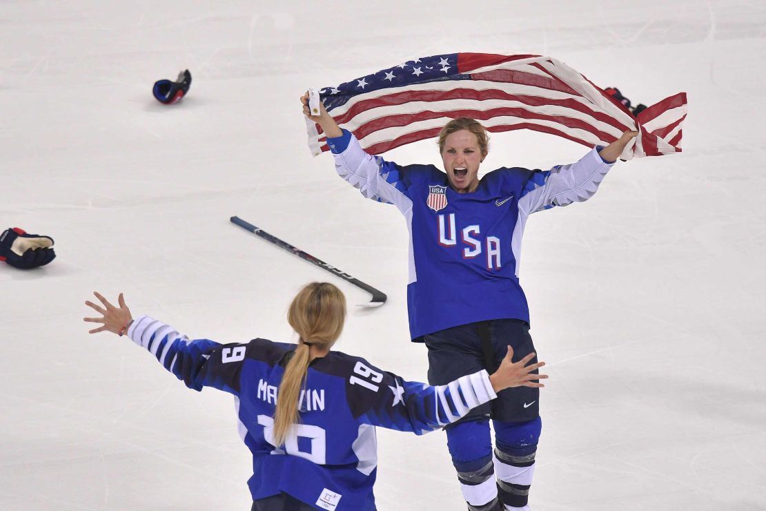 Team USA celebrates winning after a penalty shootout in the women's gold medal ice hockey match between Canada and the US.