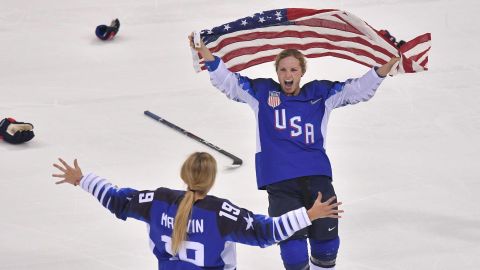 Team USA celebrates winning after a penalty shootout in the women's gold medal ice hockey match between Canada and the US.