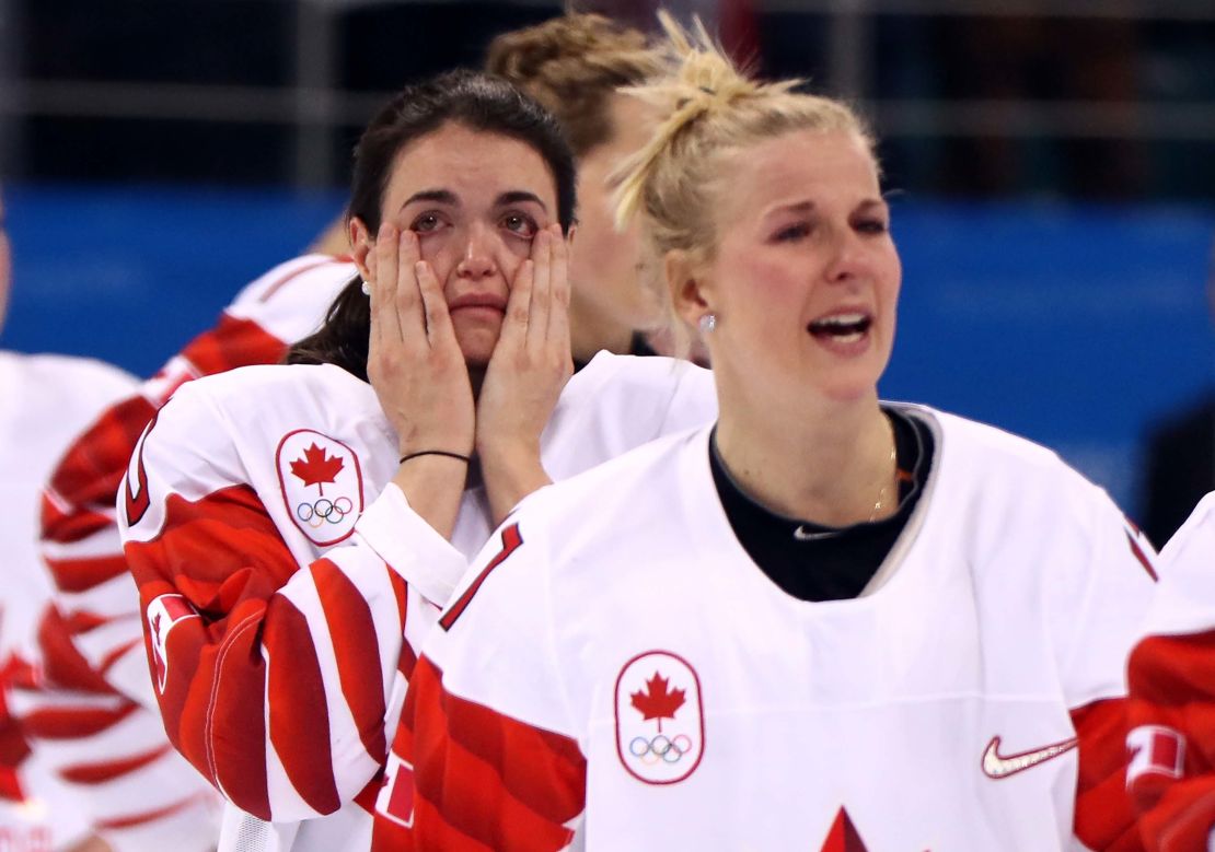 Players from Team Canada react after being defeated by Team United States 3-2 in the overtime penalty-shot shootout.