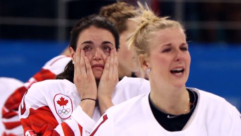 Players from Team Canada react after being defeated by Team United States 3-2 in the overtime penalty-shot shootout.