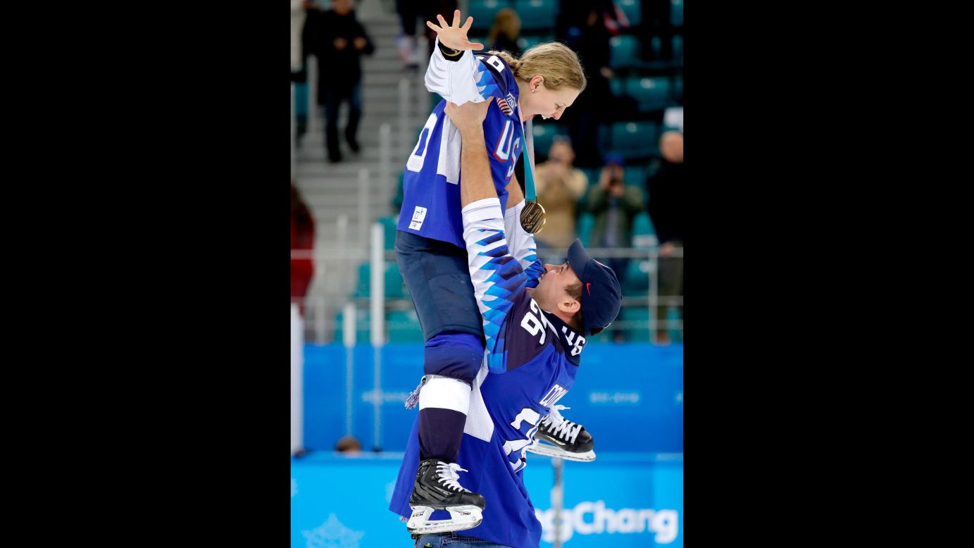 American hockey player Kendall Coyne gets hoisted by her fiancé, Michael Schofield, as they savor the <a href="https://www.cnn.com/2018/02/22/sport/olympics-ice-hockey-canada-us-intl/index.html">US women's hockey team's 3-2 victory</a> over Canada to take the Olympic gold.