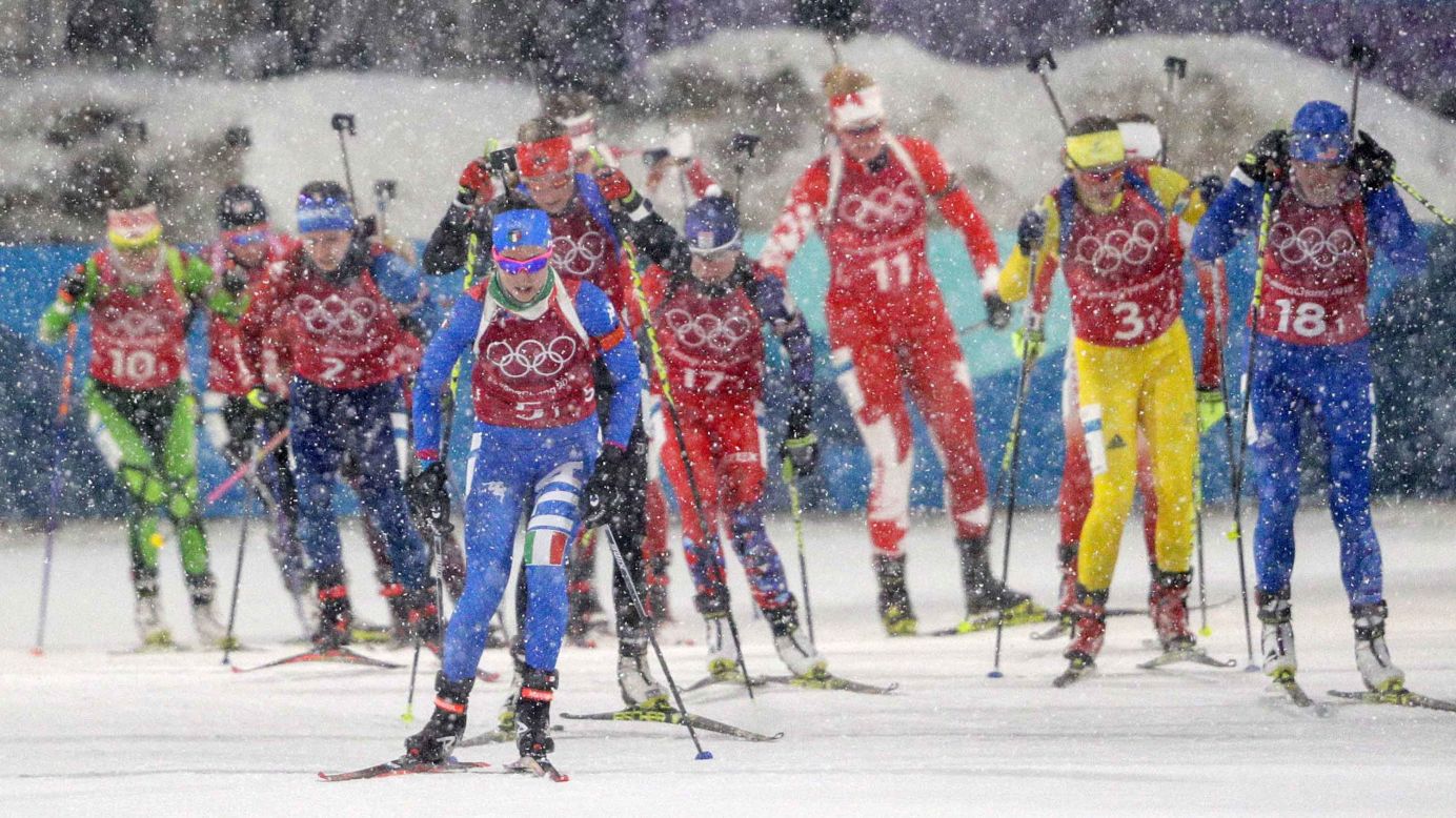 Italian biathlete Lisa Vittozzi leads a pack of skiers during the women's relay.