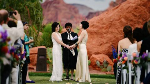 With the red rocks of southern Utah as a backdrop, Fatma Marouf, left, and Bryn Esplin vowed to spend their lives together and hoped to be parents. 