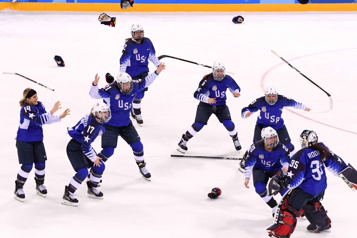 The US women's hockey team celebrates after defeating Canada in a shootout to win the gold. It's the first time the Americans have won the gold medal since 1998 when they also defeated Canada in the final.
