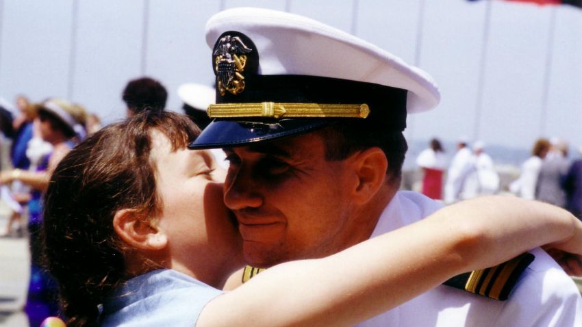 Meagan hugs her dad at his Naval War College graduation in Newport, RI, June 16, 2000.