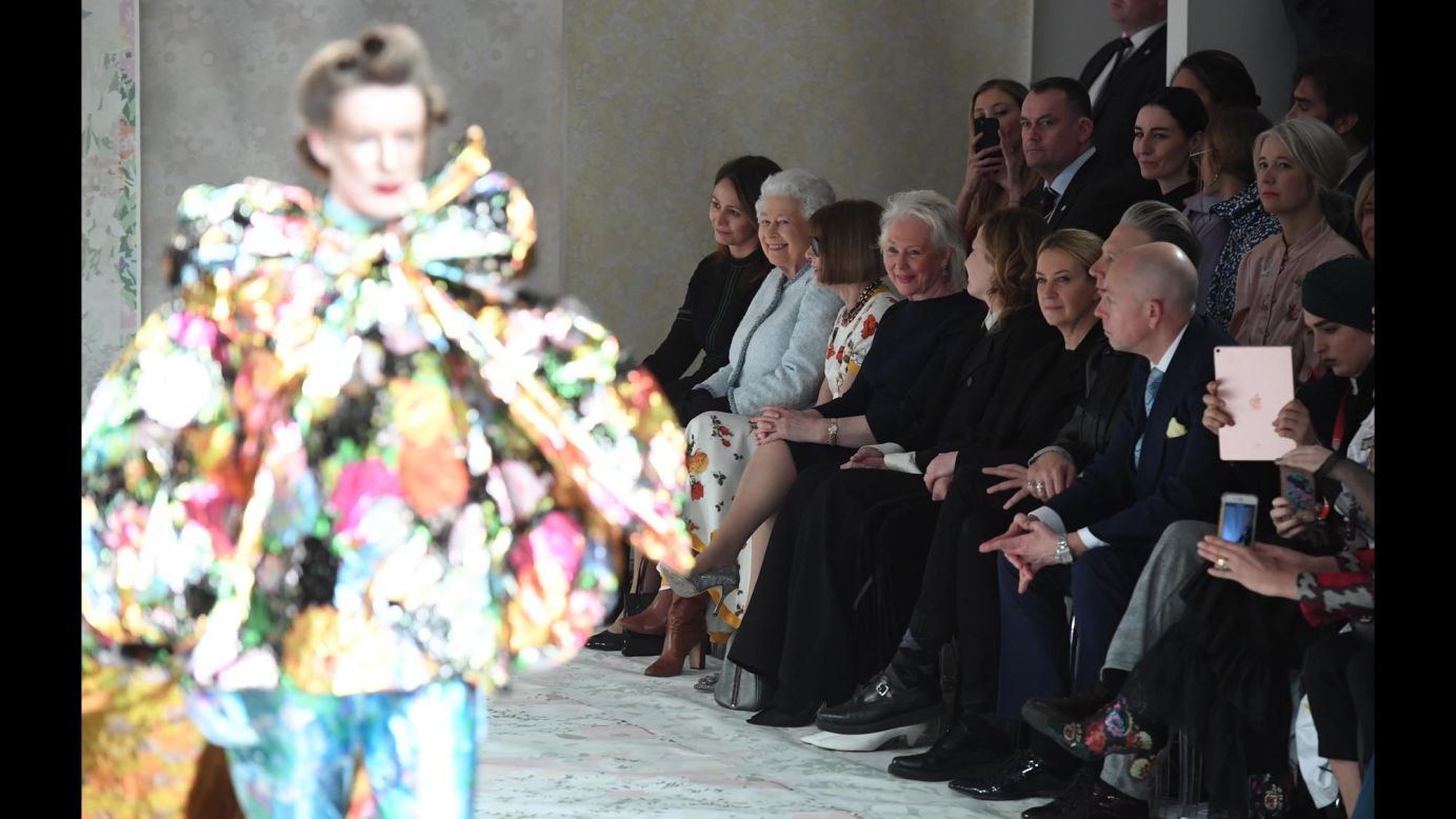 Queen Elizabeth II, in light blue, takes in the Richard Quinn runway show beside Vogue editor Anna Wintour during London Fashion Week on Tuesday, February 20. <a href="https://www.cnn.com/style/article/queen-elizabeth-london-fashion-week/index.html" target="_blank">The Queen later presented</a> the designer with the inaugural Queen Elizabeth II Award for British Design.