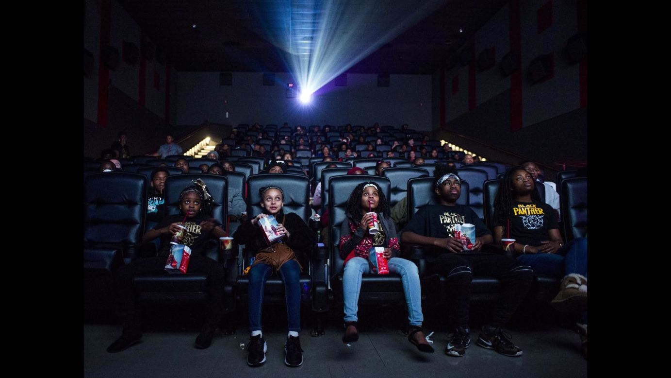 Mari Copeny, third from left, watches a <a href="https://www.cnn.com/2018/02/01/entertainment/octavia-spencer-black-panther/index.html" target="_blank">free screening</a> of the film "Black Panther" with more than 150 children, after she raised $16,000 to provide free tickets in an entire theater on Monday, February 19, in Flint, Michigan. <a href="https://www.cnn.com/2018/02/16/africa/black-panther-behind-the-scenes-marvel/index.html" target="_blank">A journey into Wakanda</a>