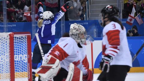 USA's Monique Lamoureux-Morando (left) celebrates scoring against Canada.
