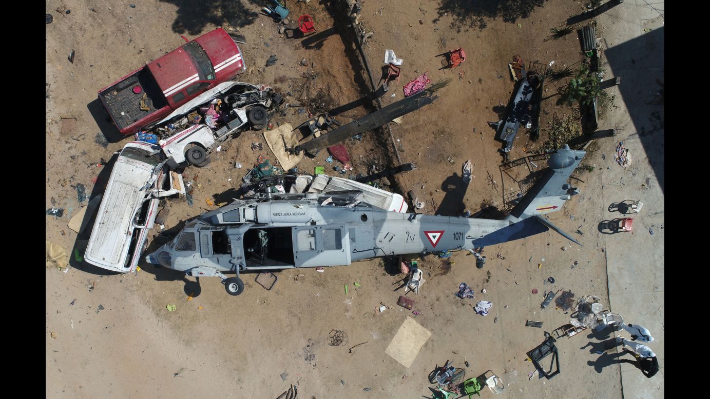 A military helicopter lies among debris in Oaxaca, Mexico, on Saturday, February 17. <a href="https://www.cnn.com/2018/02/17/americas/mexico-helicopter-crash/index.html" target="_blank">Thirteen people were killed</a> when the helicopter crashed on top of two vehicles when it attempted to land in an airfield. On board were officials surveying damage from a 7.2-magnitude earthquake the day before.