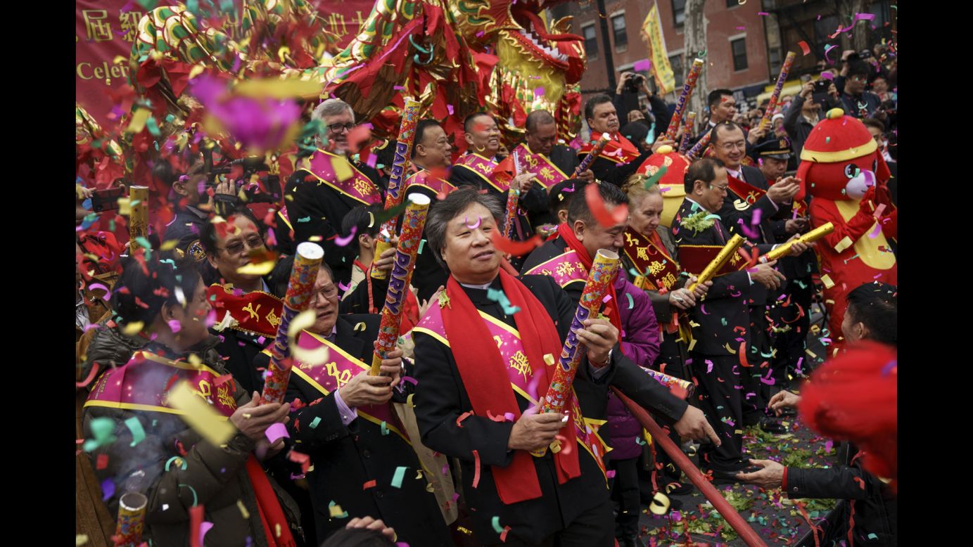 People pop crackers during a festival to mark the first day of the <a href="https://www.cnn.com/travel/article/china-lunar-new-year-journey-home-motorbike-intl/index.html" target="_blank">Lunar New Year</a> in New York City's Chinatown neighborhood on Friday, February 16. The 2018 Chinese New Year, which is the year of the dog, began on Friday and <a href="https://www.cnn.com/travel/article/lunar-new-year-etiquette-dos-donts-chinese-new-year/index.html" target="_blank">celebrations continue</a> for over two weeks.