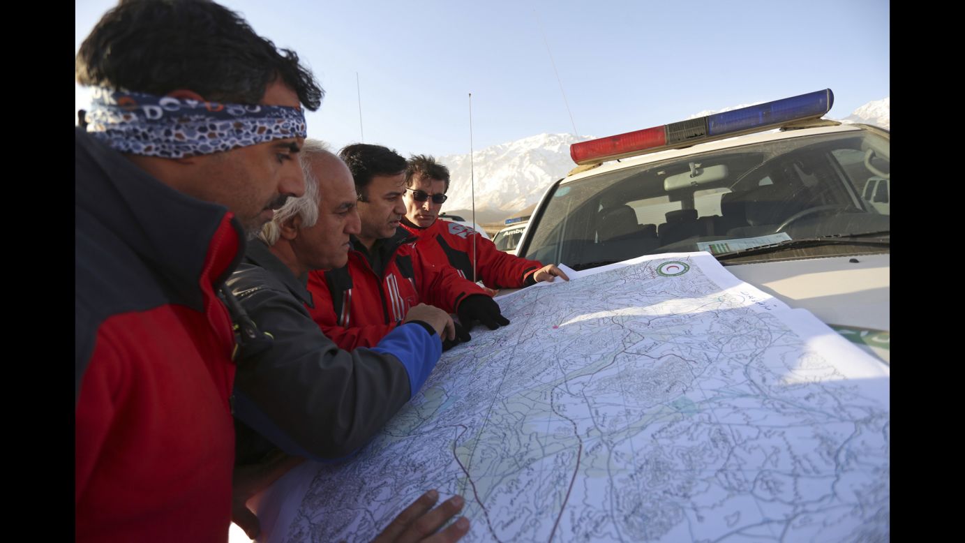 In this February 20 photo, a search and rescue team studies a map of the area where a <a href="https://www.cnn.com/2018/02/18/middleeast/iran-plane-crash/index.html" target="_blank">plane crashed</a> on February 18 on Mount Dena, in southern Iran. All <a href="https://www.cnn.com/2018/02/19/middleeast/iran-plane-crash-site-found-intl/index.html" target="_blank">65 people on board</a> the passenger plane are presumed dead, the airline said.