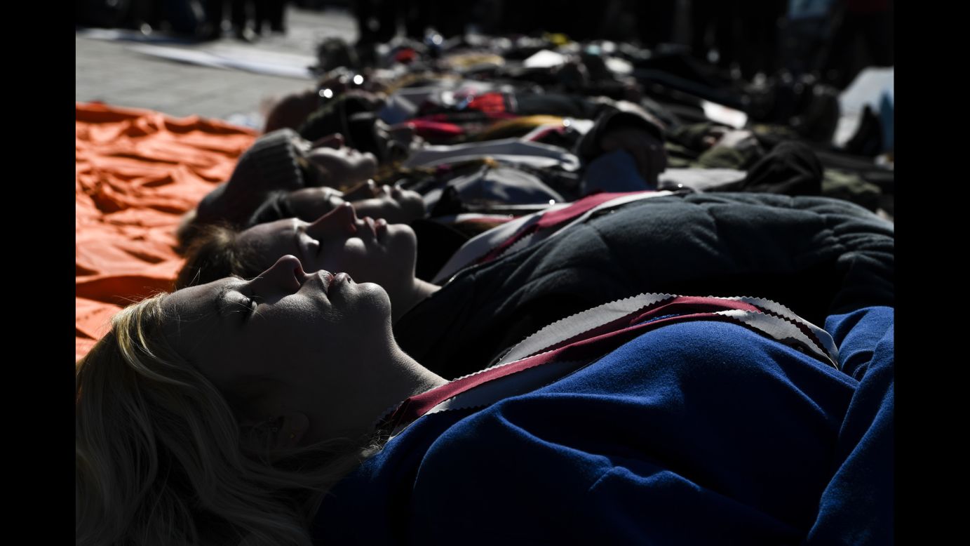 Alana Kroeker, front, lies on the ground with 16 fellow demonstrators to honor victims of the Stoneman Douglas High School shooting in Florida at the Colorado State Capitol on Wednesday, February 21. Students across the US <a href="https://www.cnn.com/2018/02/21/us/school-students-walkout-photos-trnd/index.html" target="_blank">walked out of their schools</a> in solidarity with the survivors of the shooting. <a href="https://www.cnn.com/2018/02/16/world/gallery/week-in-photos-0216/index.html" target="_blank">See last week in photos</a>