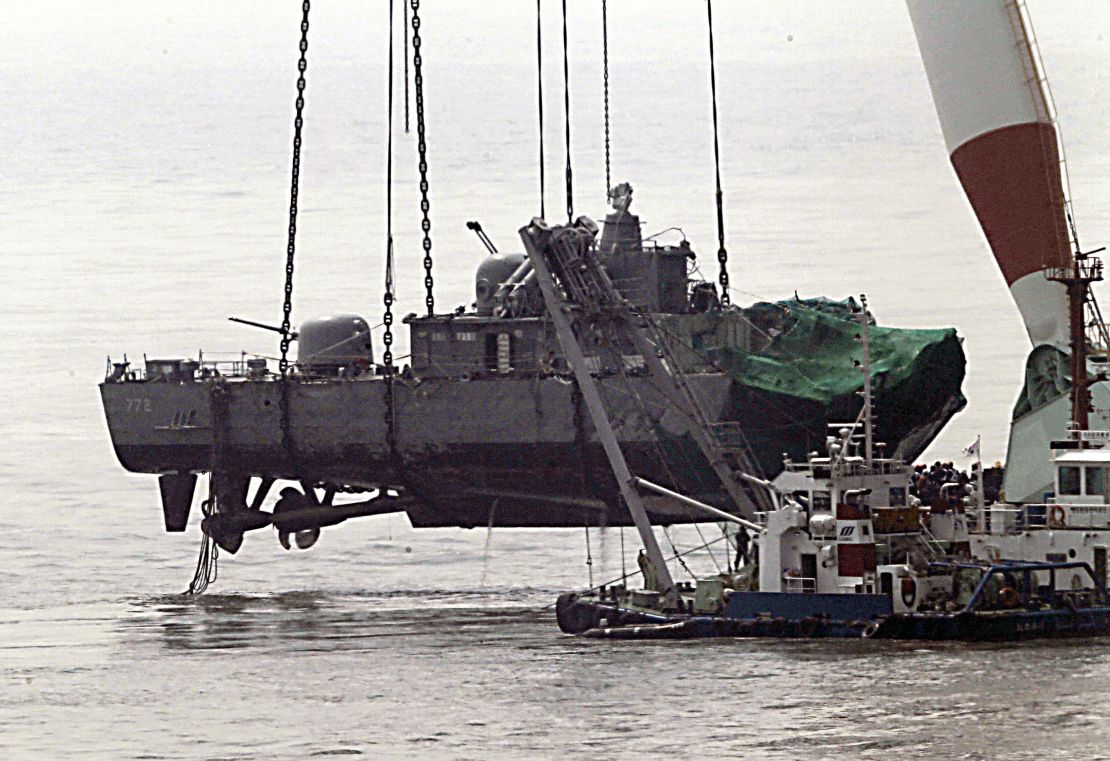 A giant floating crane lifts the stern of the 1,200-tonne sunken Cheonan to place it on a barge, before returning it to South Korea, April 15, 2010. 