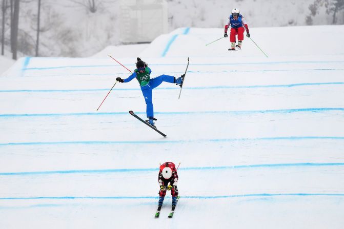 Phelan leads a quarterfinal race as Italy's Debora Pixner crashes.