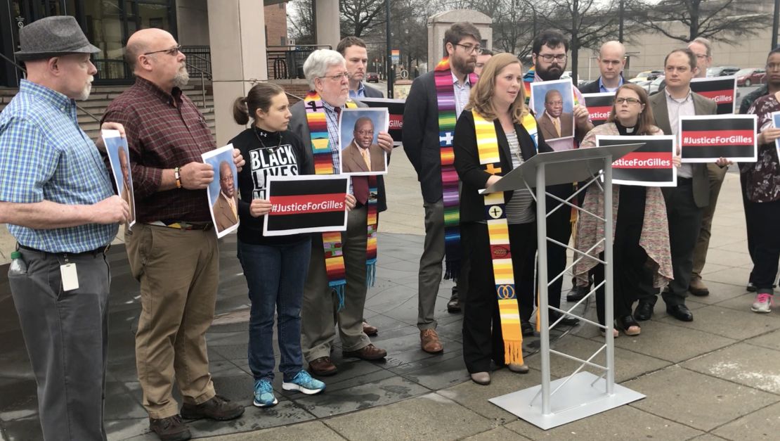 The Rev. Lauren Efird leads a vigil outside the Altanta City Detention Center, calling for Gilles Bikindou's release