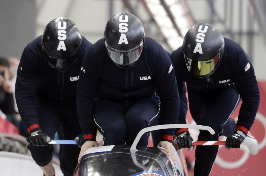 A US team starts a training run for the four-man bobsled.