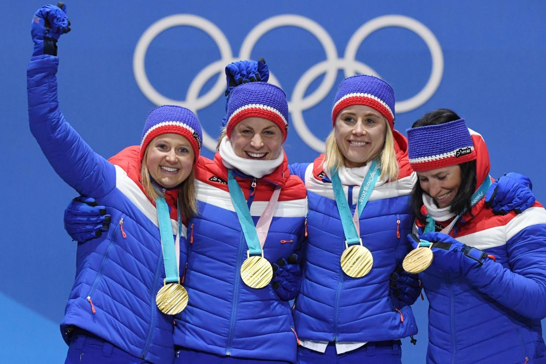 Norway's Ingvild Flugstad Oestberg, Astrid Uhrenholdt Jacobsen, Ragnhild Haga and Marit Bjeorgen pose on the podium during the medal ceremony for the cross country women's 4x5km relay.