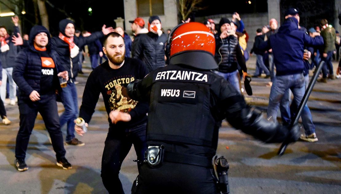 Police officers clash with supporters during riots prior to the UEFA Europa League round of 32, second leg soccer match between Athletic Bilbao and Spartak Moscow.