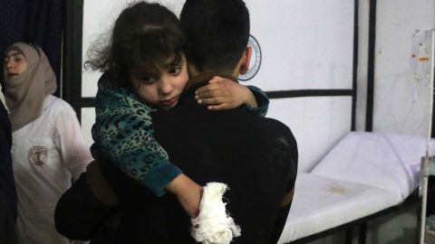 A wounded girl is carried  in Douma, Eastern Ghouta.