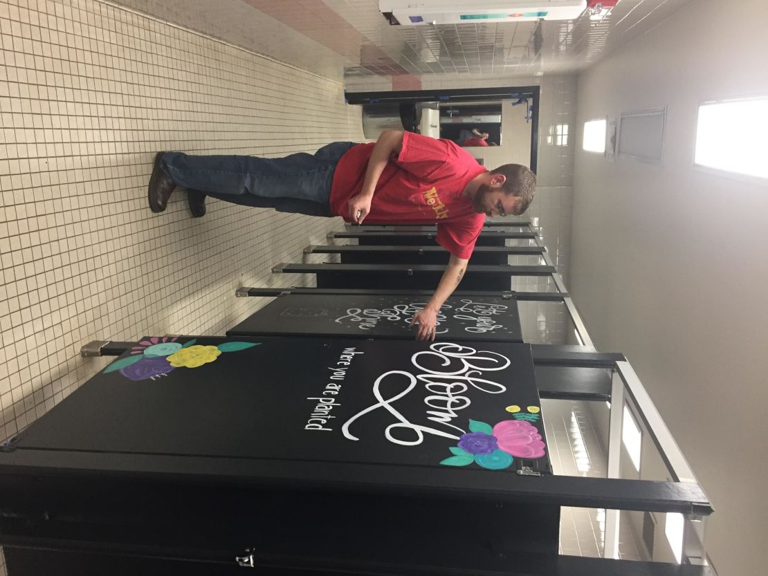 TX parents work on motivational bathroom stalls