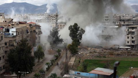 Smoke billows following Syrian government bombardments on Kafr Batna, in the besieged region of Eastern Ghouta.