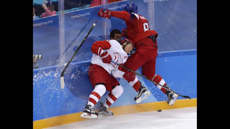 Russia's Sergei Andronov, left, collides with Jakub Nakladal of the Czech Republic during a semifinal hockey game. The Russian athletes won 3-0 to advance to the final.