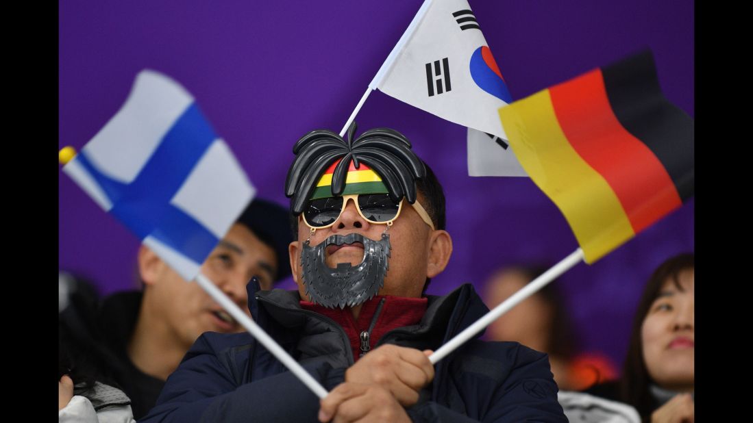 A spectator gets into the spirit of the Games during the 1,000-meter speedskating event.