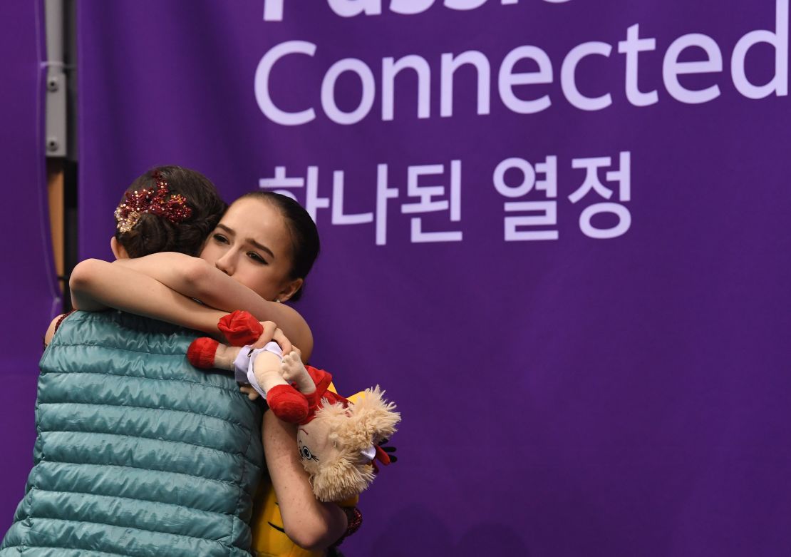Alina Zagitova (right) hugs Evgenia Medvedeva after the scores are announced. 