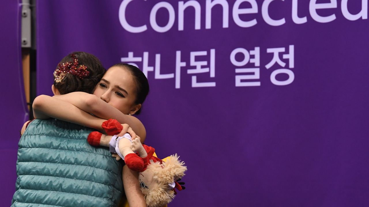 Alina Zagitova (right) hugs Evgenia Medvedeva after the scores are announced.
