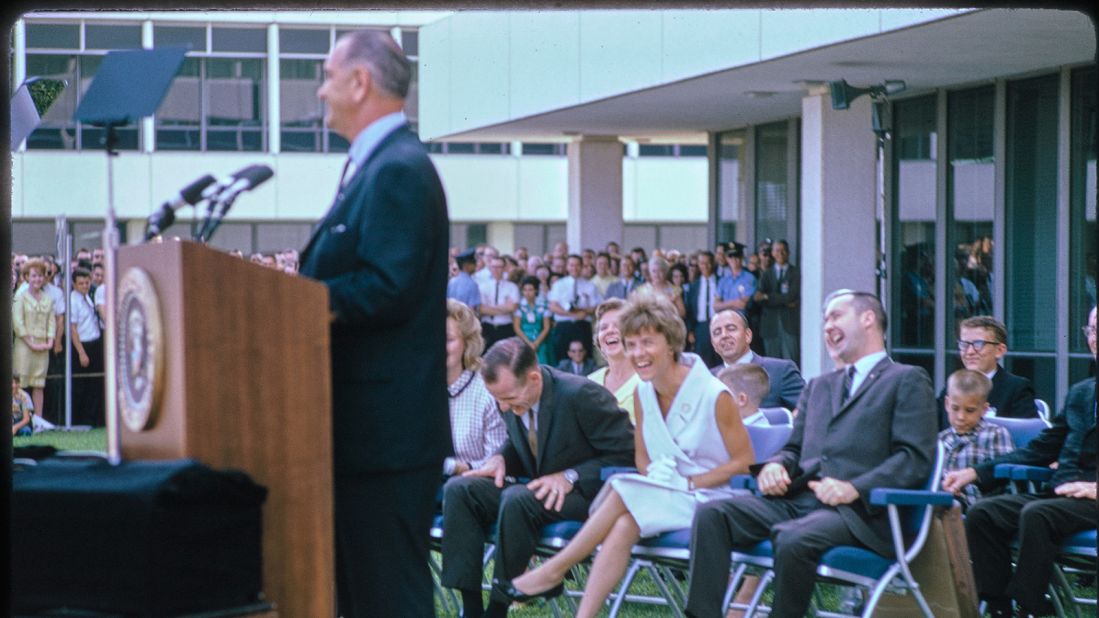 This photograph by Joseph J. Scherschel shows scenes from President Lyndon B. Johnsons visit to NASAs Manned Spaceflight Center in Houston, Texas. The purpose of the visit was a speech to honor the crew of the Gemini 4 mission and Johnson nominated astronauts James McDivitt and Edward White for promotion to the rank of lieutenant colonel. The Gemini 4 mission spanned four days and 62 Earth orbits, and included the first American spacewalk. Here, Johnson is delivering his remarks.The Manned Spaceflight Center was established in 1961 where it served the Mission Control Center for NASAs spaceflight program and led the Gemini, Apollo, and Skylab missions. In 1973, it was renamed the Lyndon B. Johnson Space Center in honor of the former president whose home state was Texas. Today, the center continues to serve as Mission Control and leads NASAs International Space Station operations.