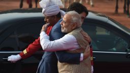 India's Prime Minister Narendra Modi (R) embraces Canada's Prime Minister Justin Trudeau (C) during a ceremonial reception at the Presidential Palace in New Delhi on February 23, 2018.
