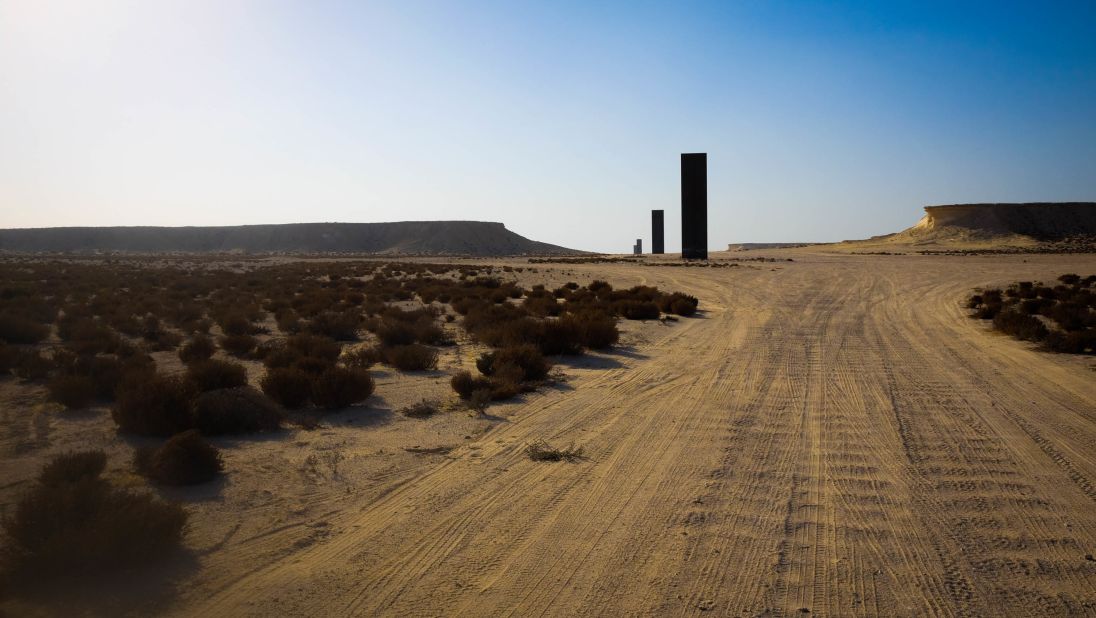 <strong>Dramatic appearance:</strong> The monoliths rear up over the horizon, appearing to dwarf nearby limestone cliffs.