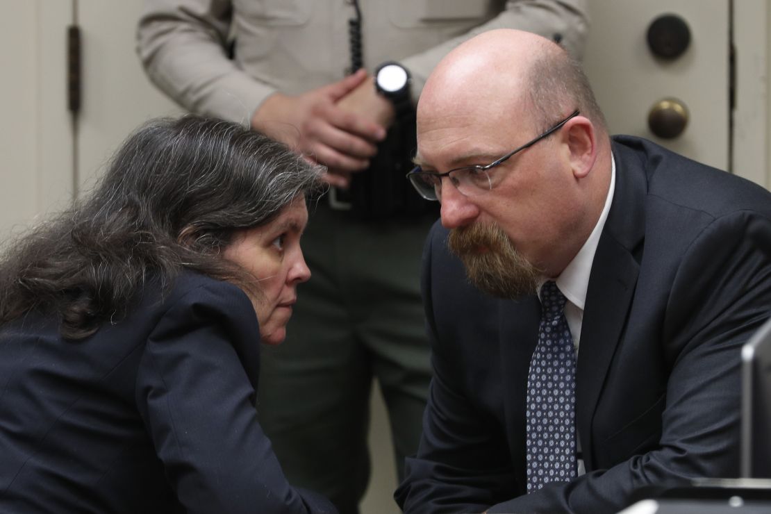 Louise Turpin talks with attorney Jeff Moore during Friday's court proceedings.
