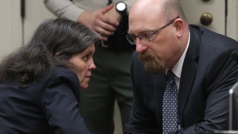 Louise Turpin talks with attorney Jeff Moore during Friday's court proceedings.