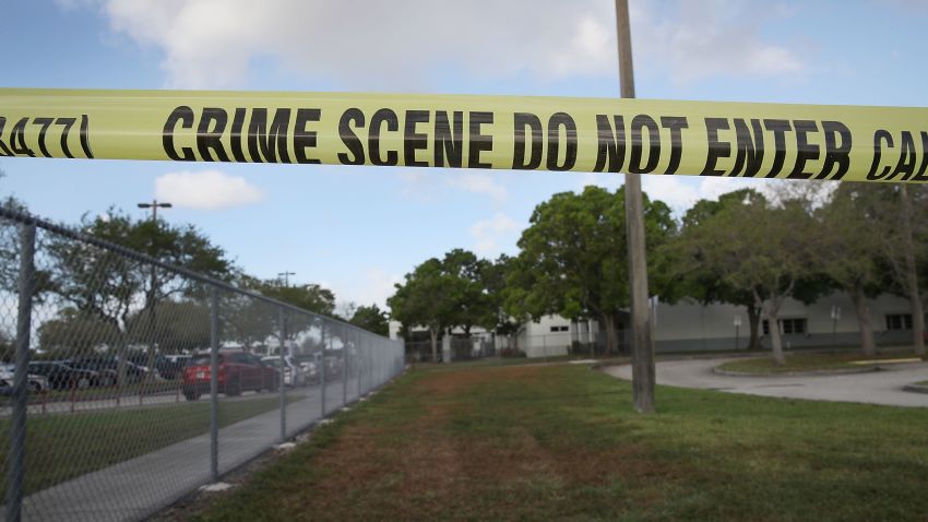 PARKLAND, FL - FEBRUARY 23: Crime scene tape is seen outside Marjory Stoneman Douglas High School as teachers and staff are allowed to return to the school for the first time since the mass shooting on campus on February 23, 2018 in Parkland, Florida. Police arrested 19-year-old former student Nikolas Cruz for killing 17 people at the high school. (Photo by Joe Raedle/Getty Images)