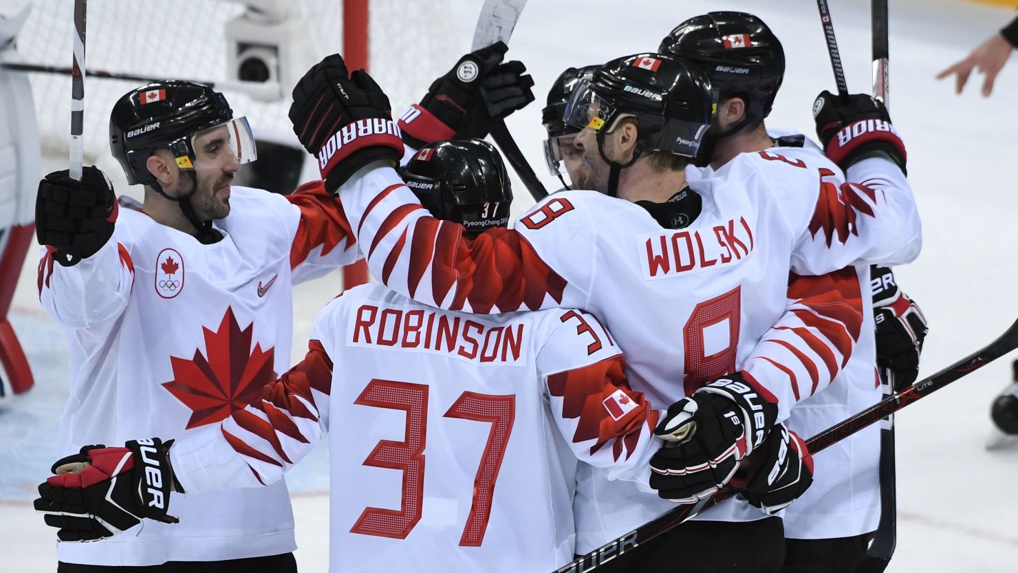 Canada's Wojciech Wolski  (second right) celebrates scoring in the men's bronze medal ice hockey match between the Czech Republic and Canada at the Gangneung Hockey Centre in Pyeongchang. 