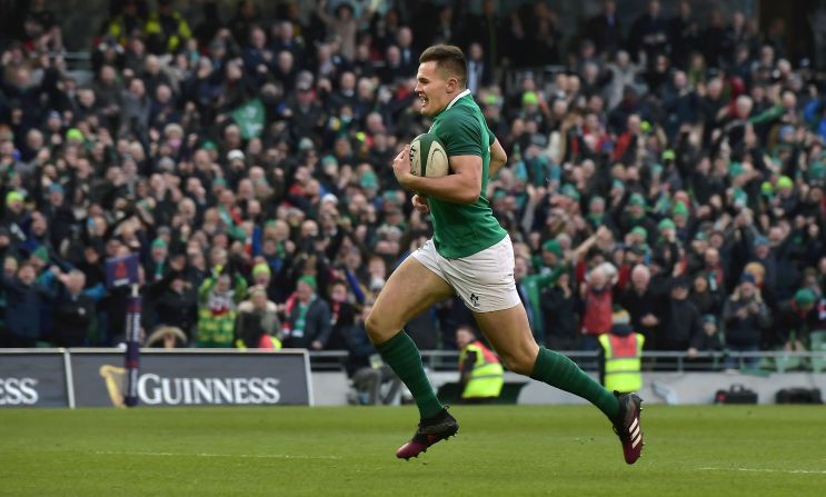 Jacob Stockdale scores his decisive second try to seal Ireland's 37-27 victory over Wales in Dublin. 
