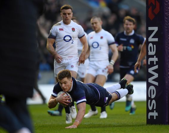 Huw Jones dives over for his seventh try in eight internationals to give Scotland an early lead over England at Murrayfield. 