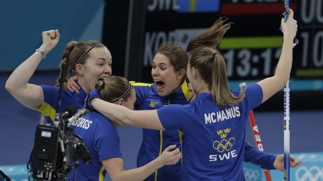 The Swedish women's curling team celebrates its win over South Korea in the gold-medal game.