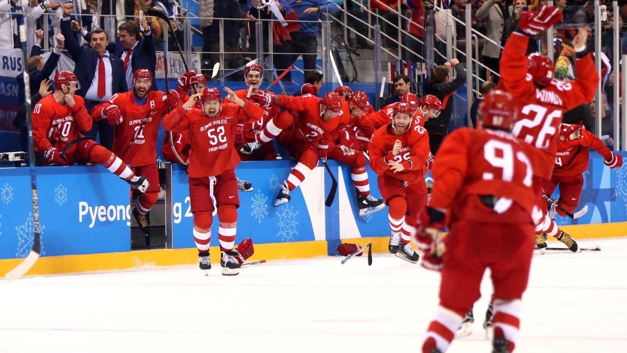 The Olympic athletes from Russia celebrate after winning the men's hockey final. They defeated Germany 4-3 in overtime.