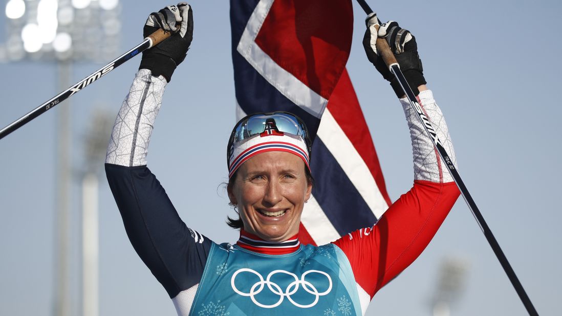 Norwegian cross-country skier Marit Bjørgen celebrates after winning the final event of these Olympics. She finished with five medals in Pyeongchang and is the most decorated Winter Olympian of all time (15 medals in all).