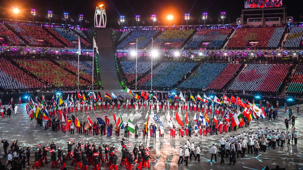 Flagbearers arrive to the closing ceremony.
