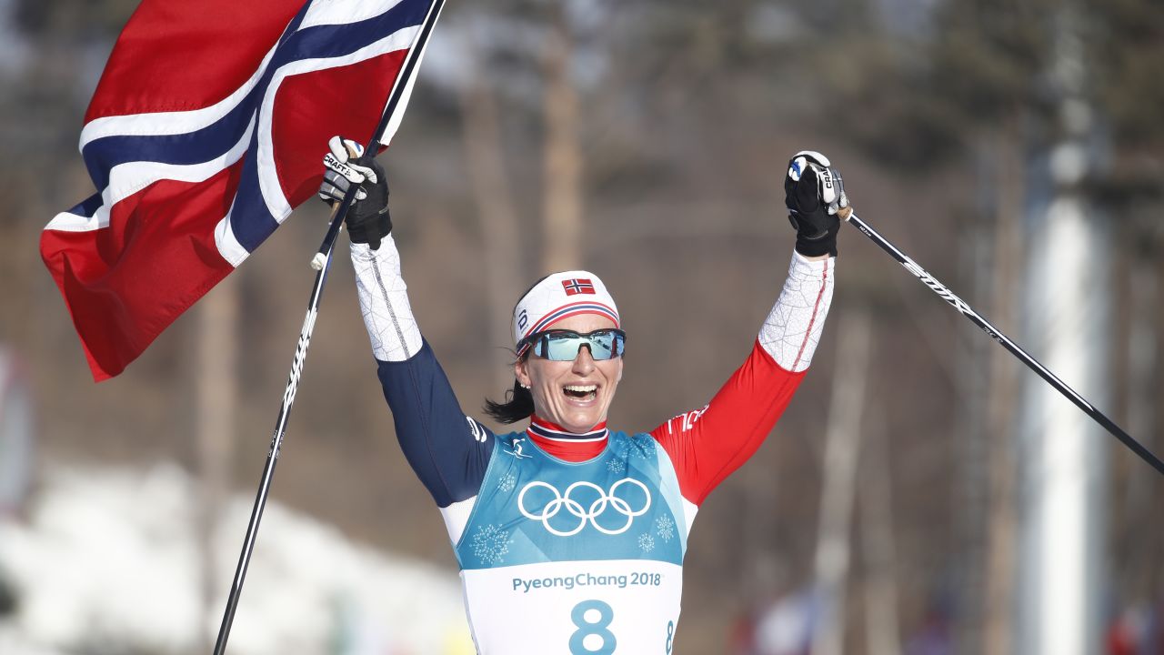 Norway's Marit Bjoergen celebrates after winning the women's 30km cross-country mass start.