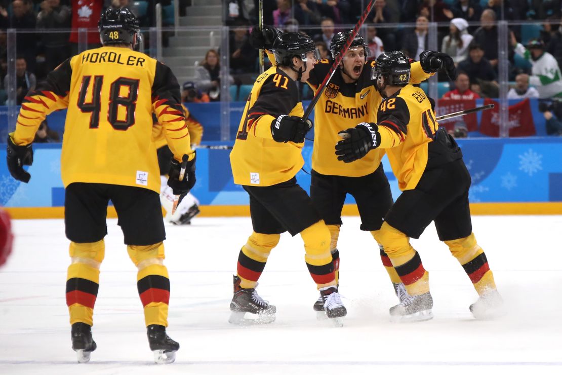 The German ice hockey team in action during the gold medal match.  