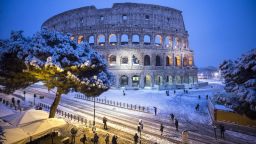 epa06565682 The Colosseum is covered by snow during a snowfall in Rome, Italy, 26 February 2018. Schools and public offices were closed and snow-removal crews were in place as Rome was on high alert for a first winter blast. Snowfall last week in Rome brought the capital to a standstill for days.  EPA-EFE/ANGELO CARCONI