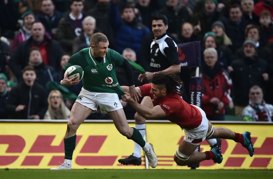 Keith Earls tries to escape the clutches of Welsh flanker Josh Navidi.