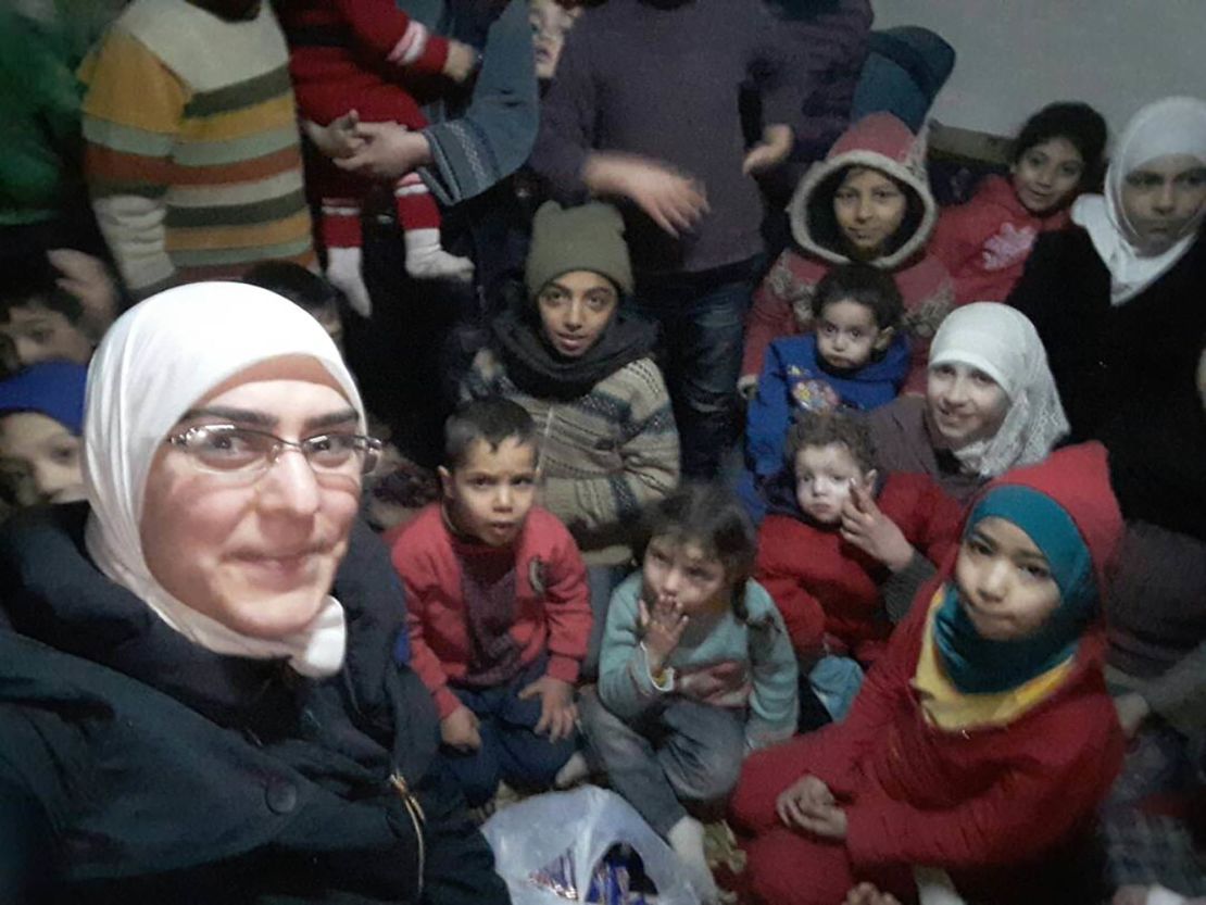 Bayan Rehan, the author of this article, with children in one of Eastern Ghouta's basements.